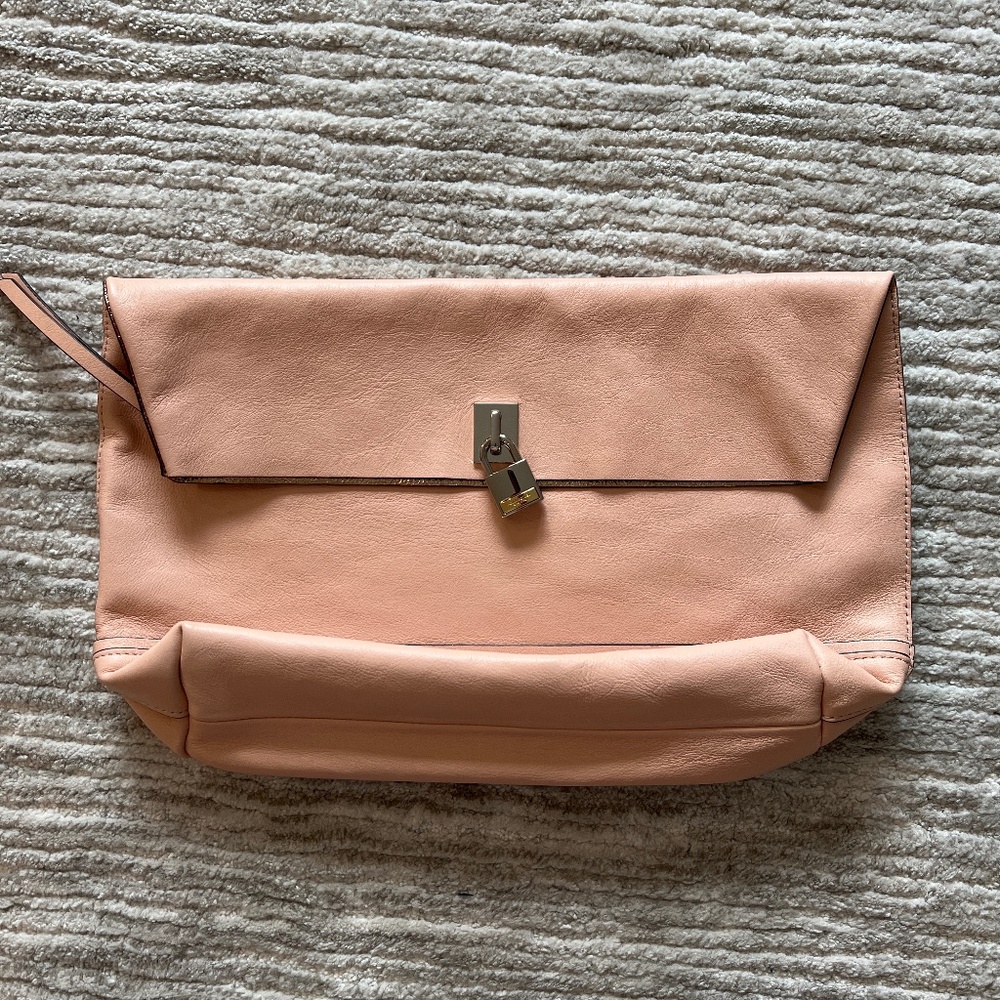 Henri Bendel blush pick leather fold over clutch with signature lock